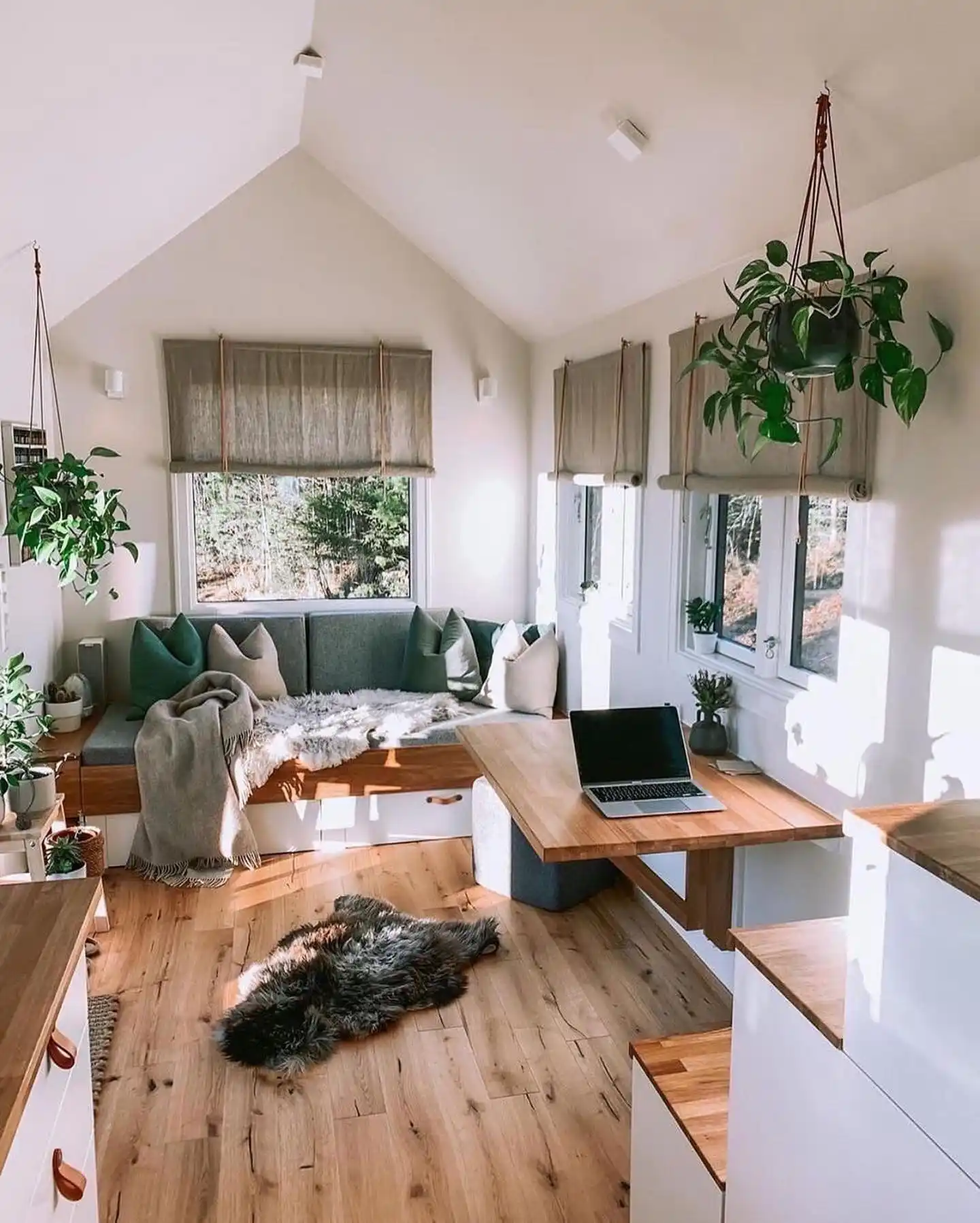 10. Window Bench and Wall Mounted Desk Under a White Gable