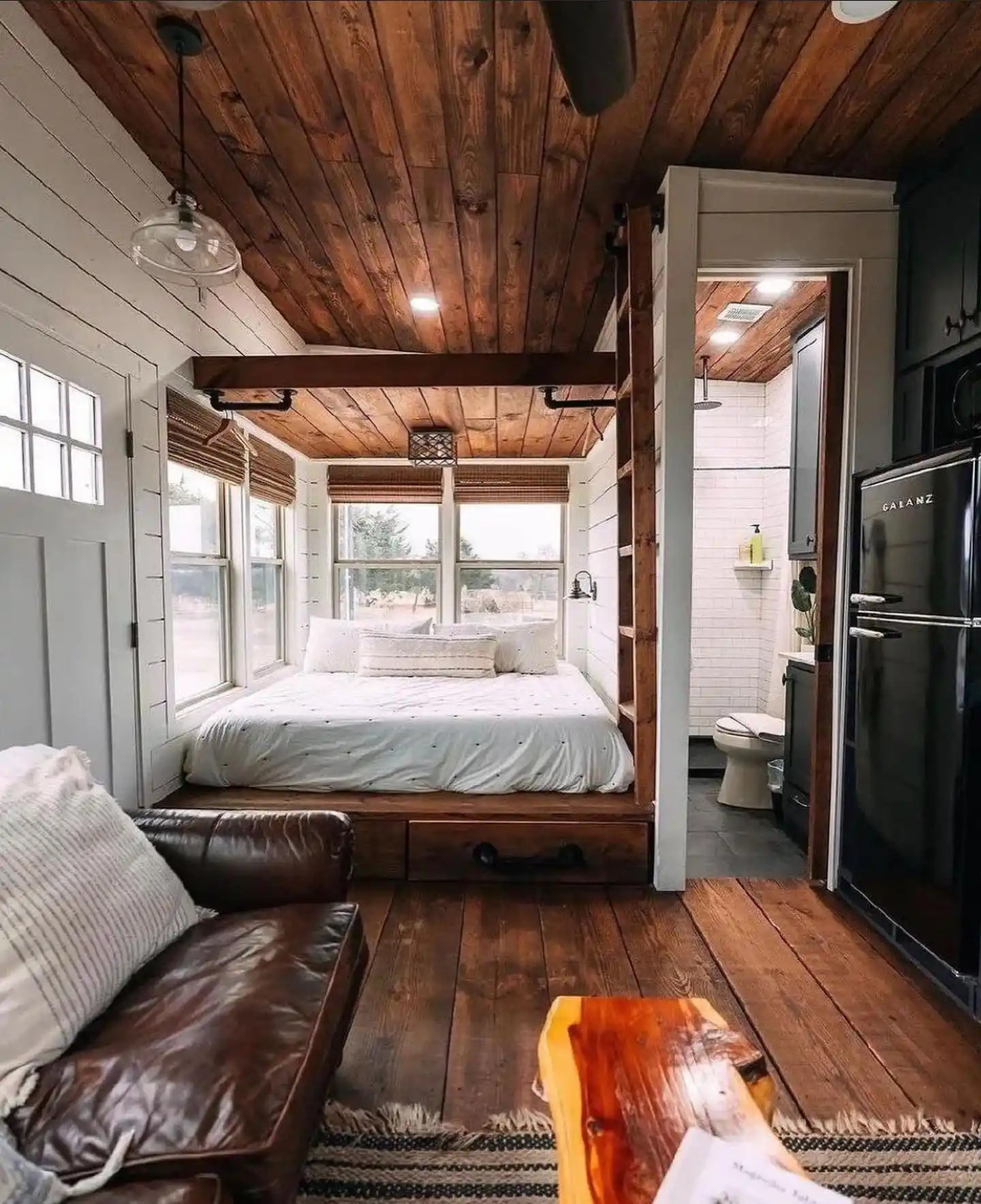 5. Wood Plank Cabin with a Platform Bed