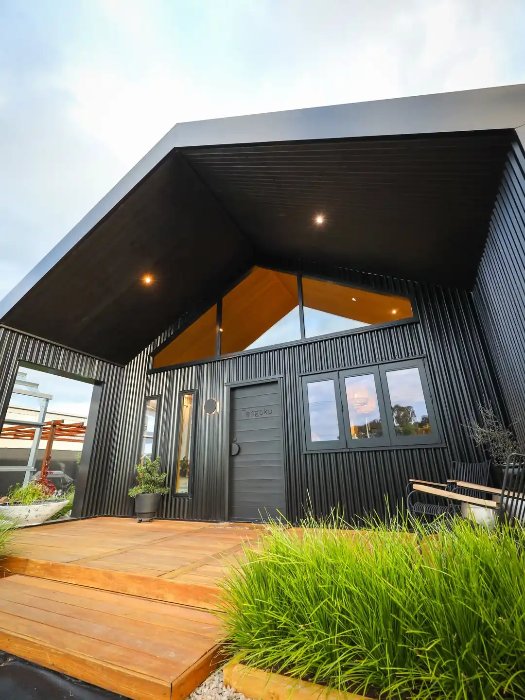 5. Black Corrugated Cladding Against a Warm Timber Deck