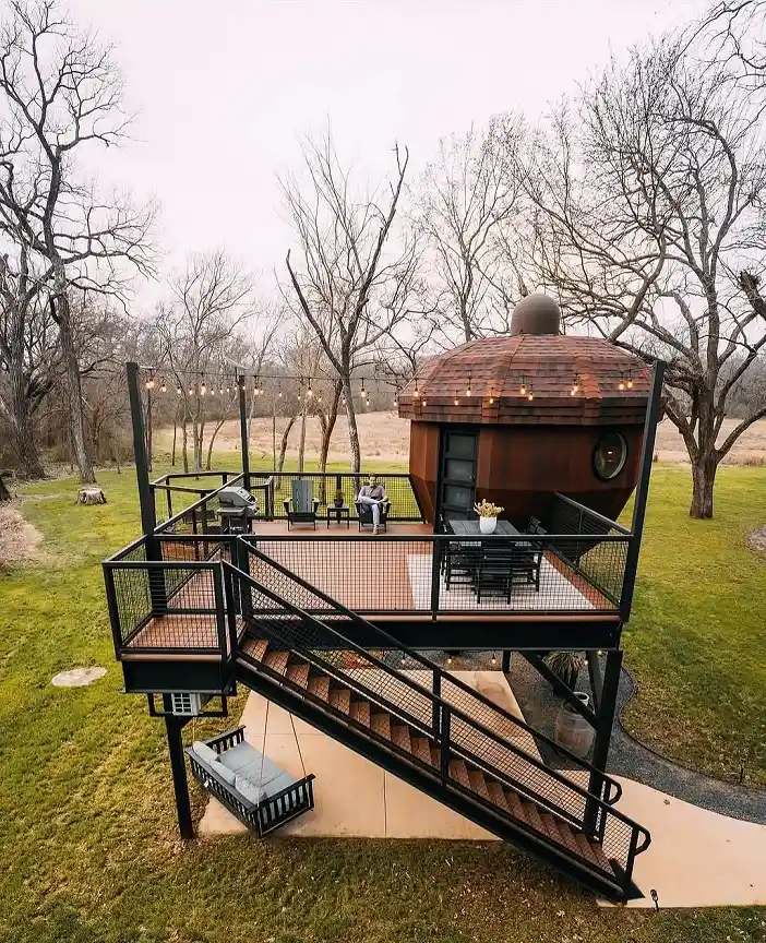 15 Tiny House Ideas for Couples Who Live Small Full-Time 13 12. A Rust Toned Pod on a Steel Deck
