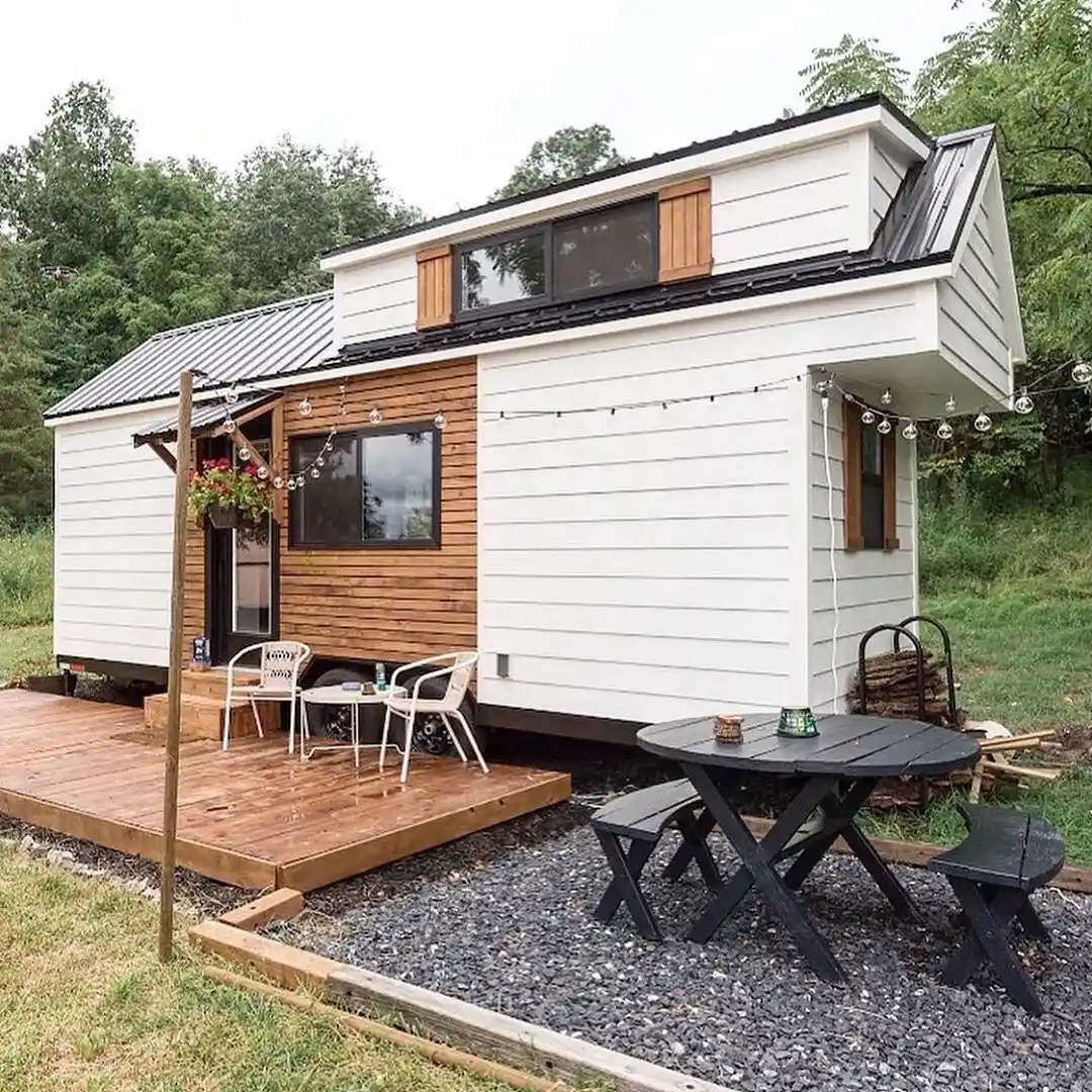 15 Tiny House Ideas for Couples Who Live Small Full-Time 8 7. Two Outdoor Rooms Around a White Tiny House