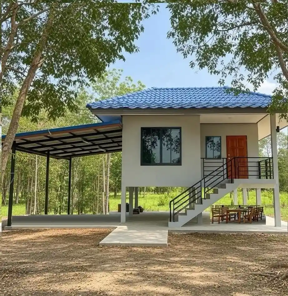 5. Raised Stucco House with a Blue Roof