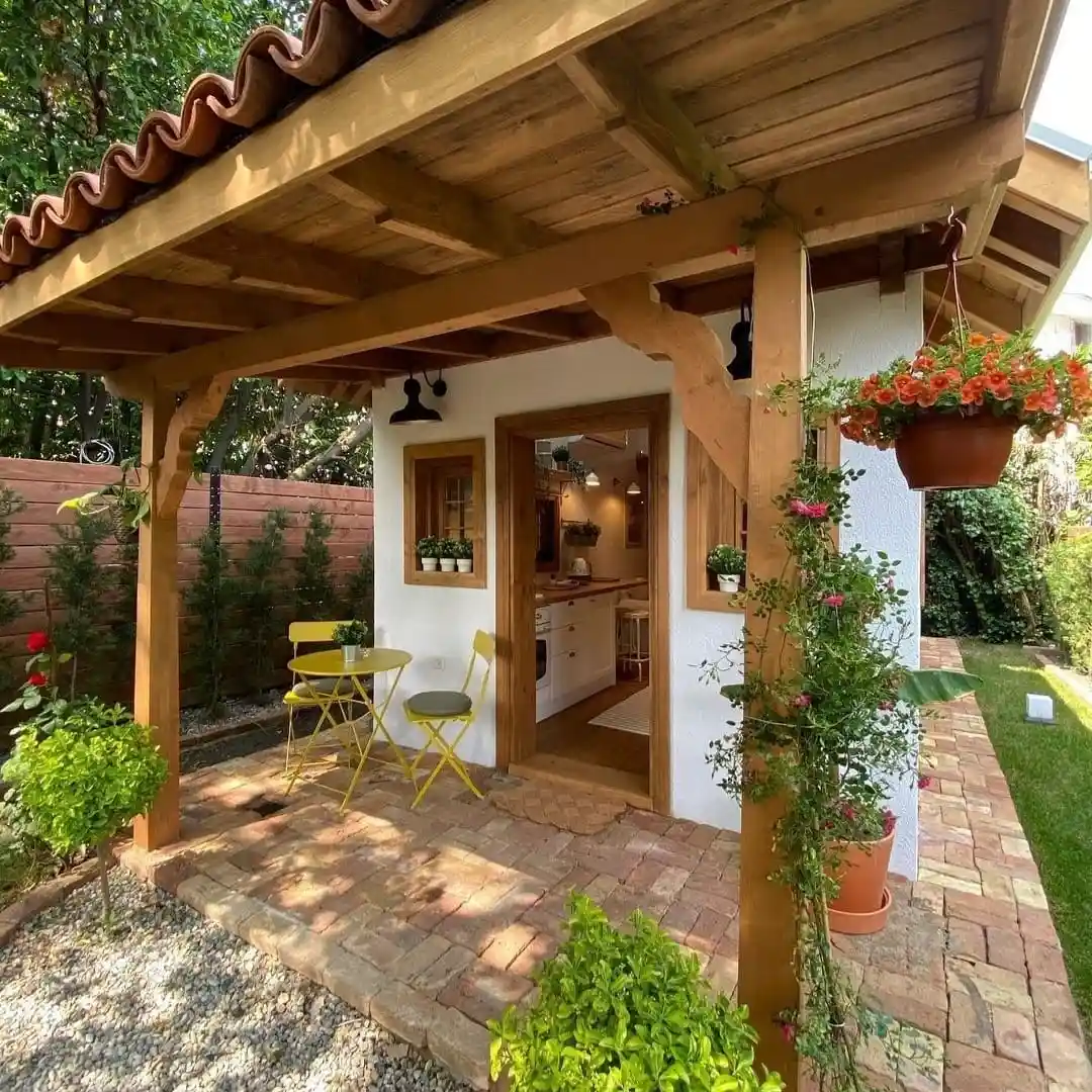 4. Terracotta Patio Cottage Under a Timber Porch