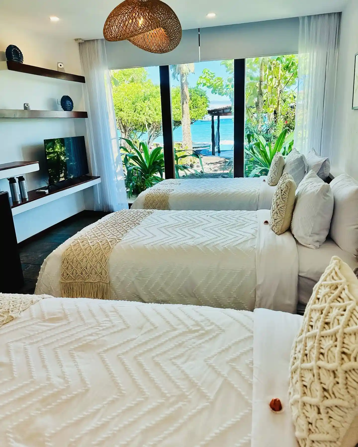 6. Triple Bed Bedroom with Macramé Accents