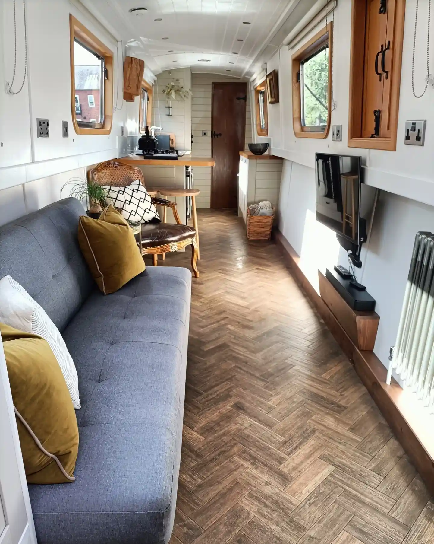 3. A Long Lounge With Herringbone Floors