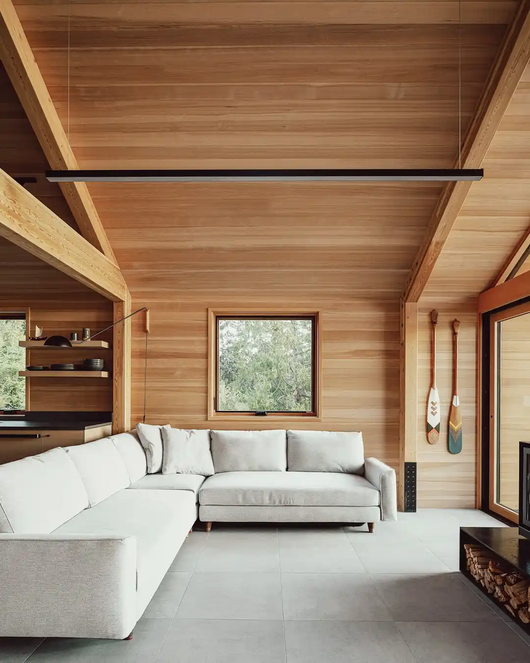 8. Honey Wood Walls With a Pale Gray Sectional
