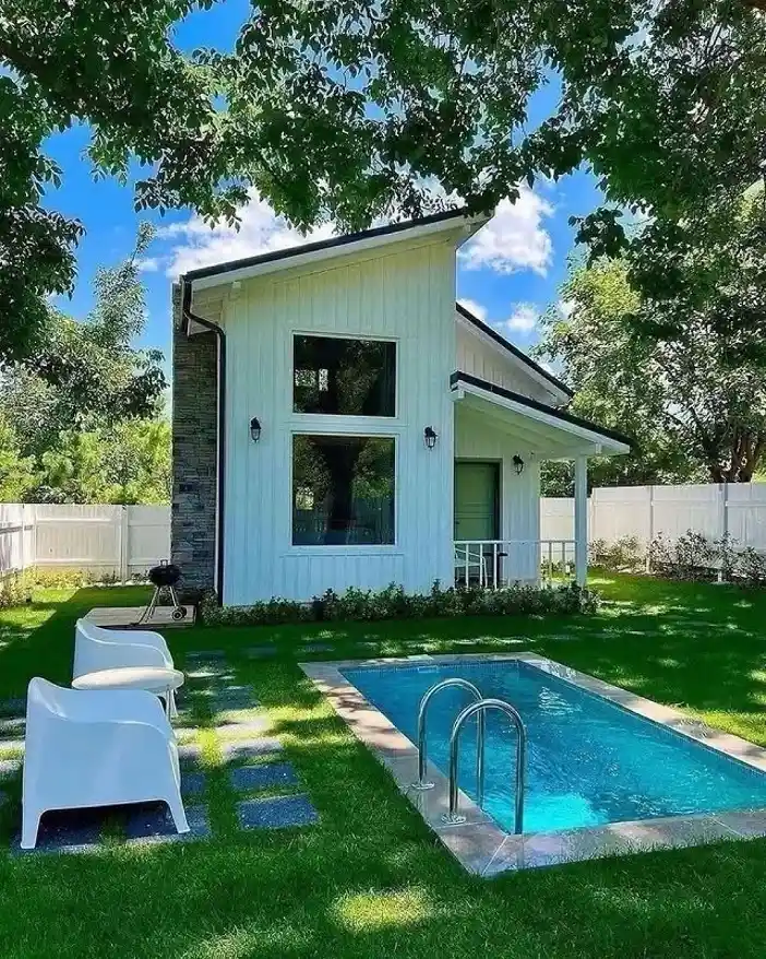 9. Slanted Roof Cottage with a Backyard Pool