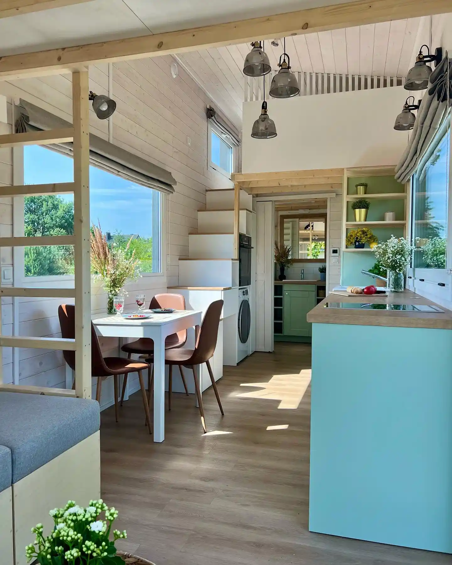 13. Aqua Kitchen Run With a Dining Nook and Smoked Glass Lights
