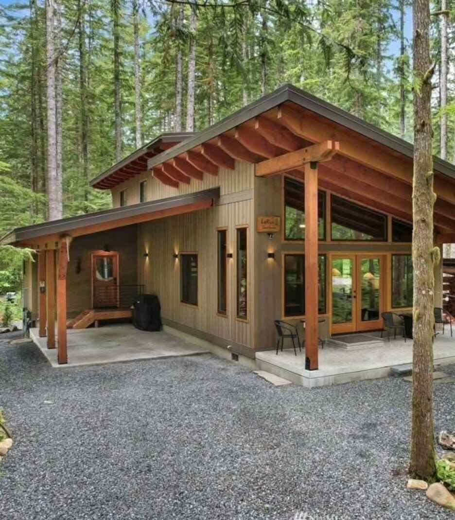 14. Forest Cabin with Exposed Rafters and Concrete Patios