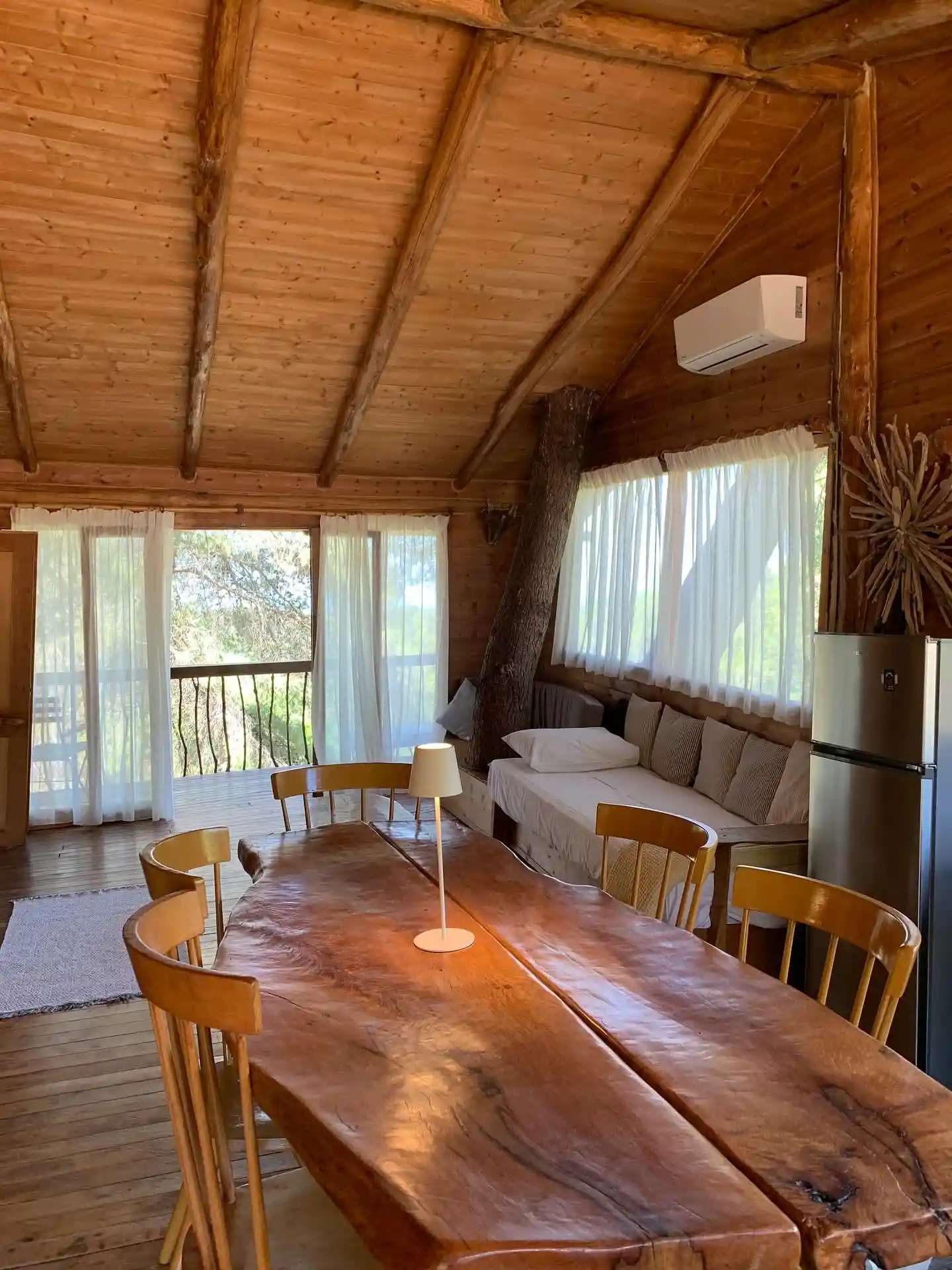 2. A Dining Table and Daybed Share One Room