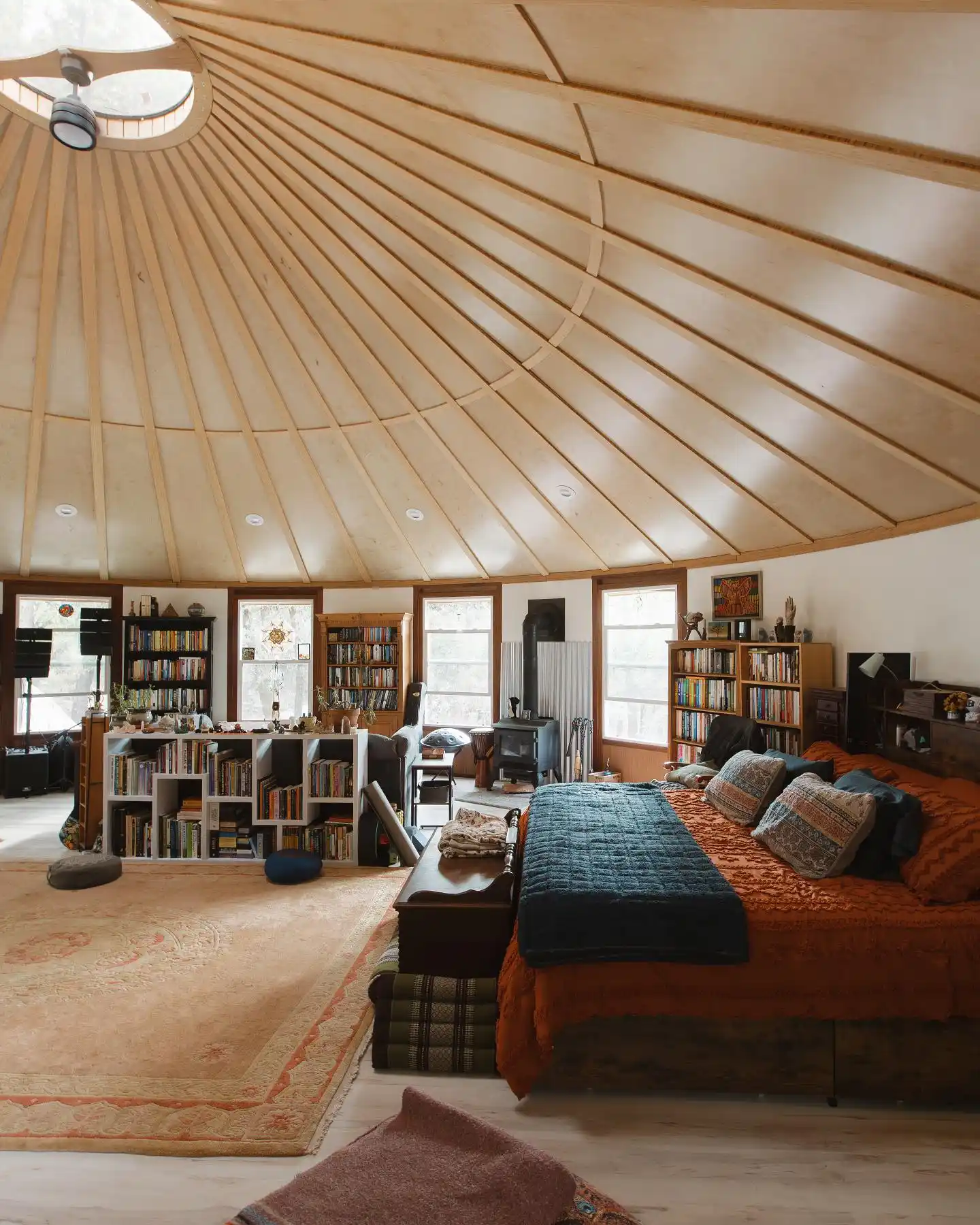 17 Yurt Living Ideas for a Cozy Off-Grid Lifestyle 13 12. Bookshelves as Room Dividers