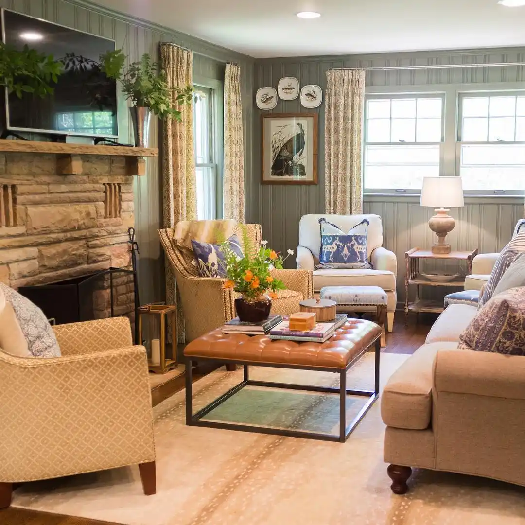14. Sage Paneled Walls and a Stone Fireplace