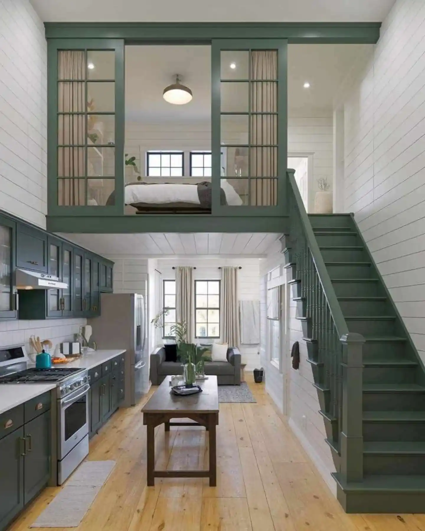 15 Tiny House Decor Ideas That Make Small Spaces Look Stylish 9 8. Forest Green Trim on a White Shiplap Shell