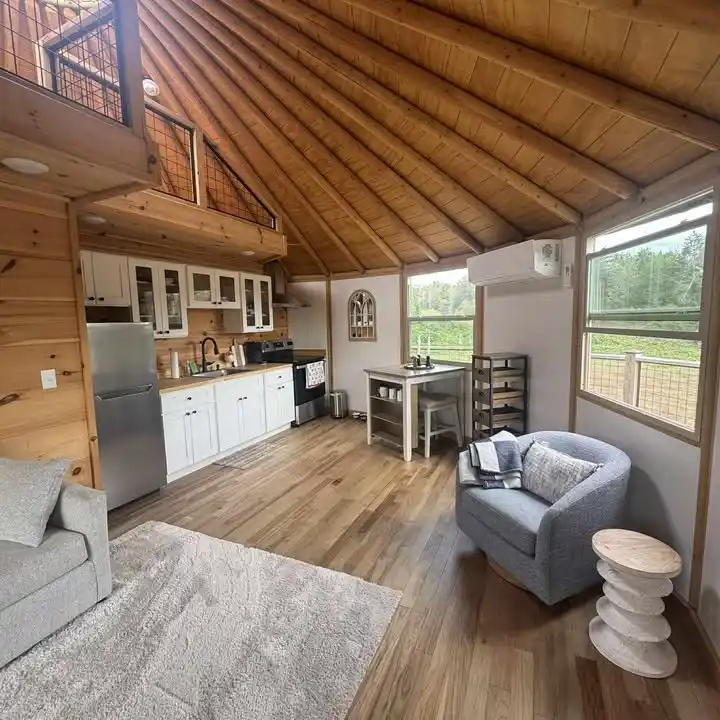 17 Yurt Living Ideas for a Cozy Off-Grid Lifestyle 7 6. White Cabinets Against Warm Pine