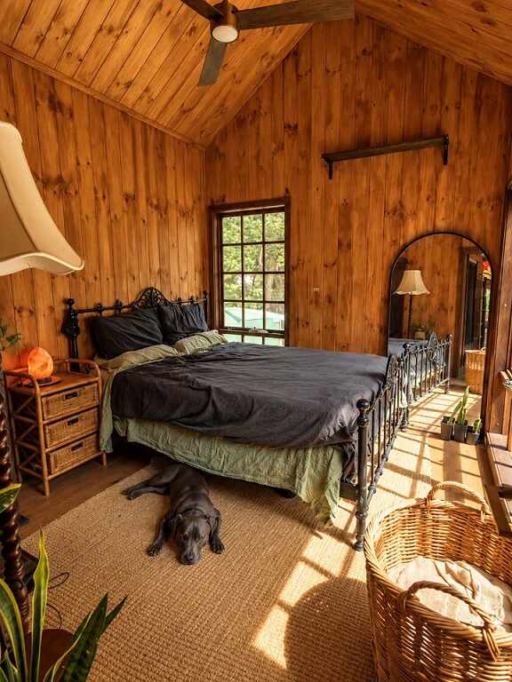 Vaulted Pine Bedroom With an Iron Bed