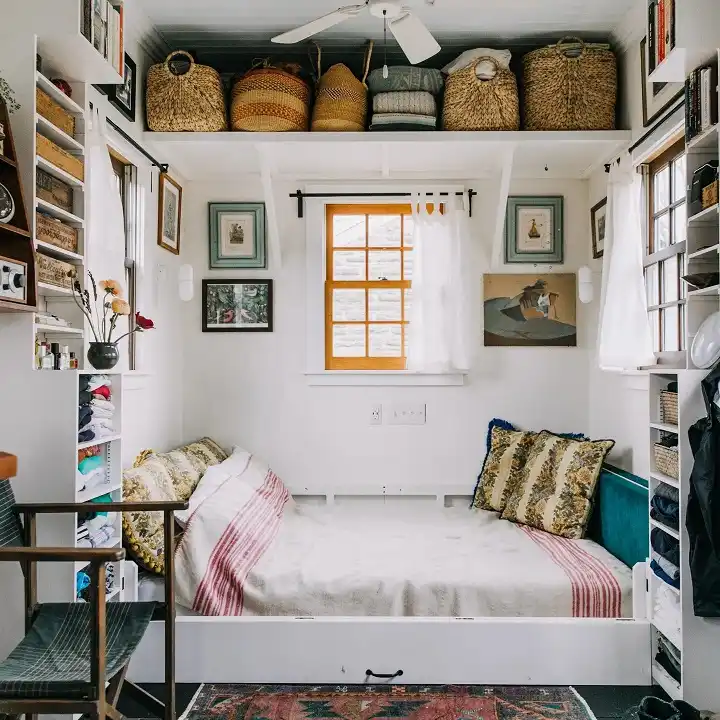 Bed Alcove Framed by Open Clothes Shelves