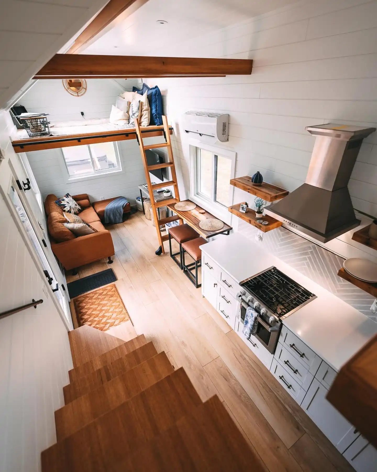 15 Tiny House Kitchen Ideas With Full-Size Function 6 White Shaker Run With a Window Bar Counter