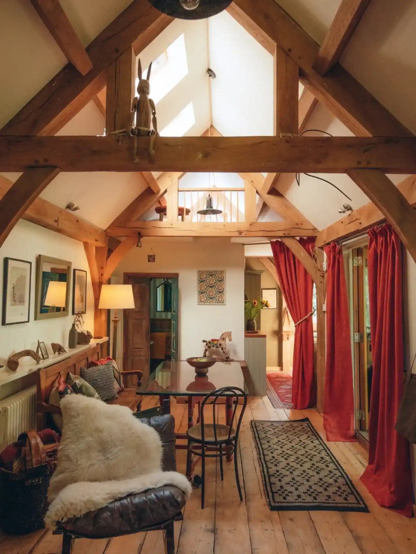14. Red Curtains Warm a Pale Timber Hall